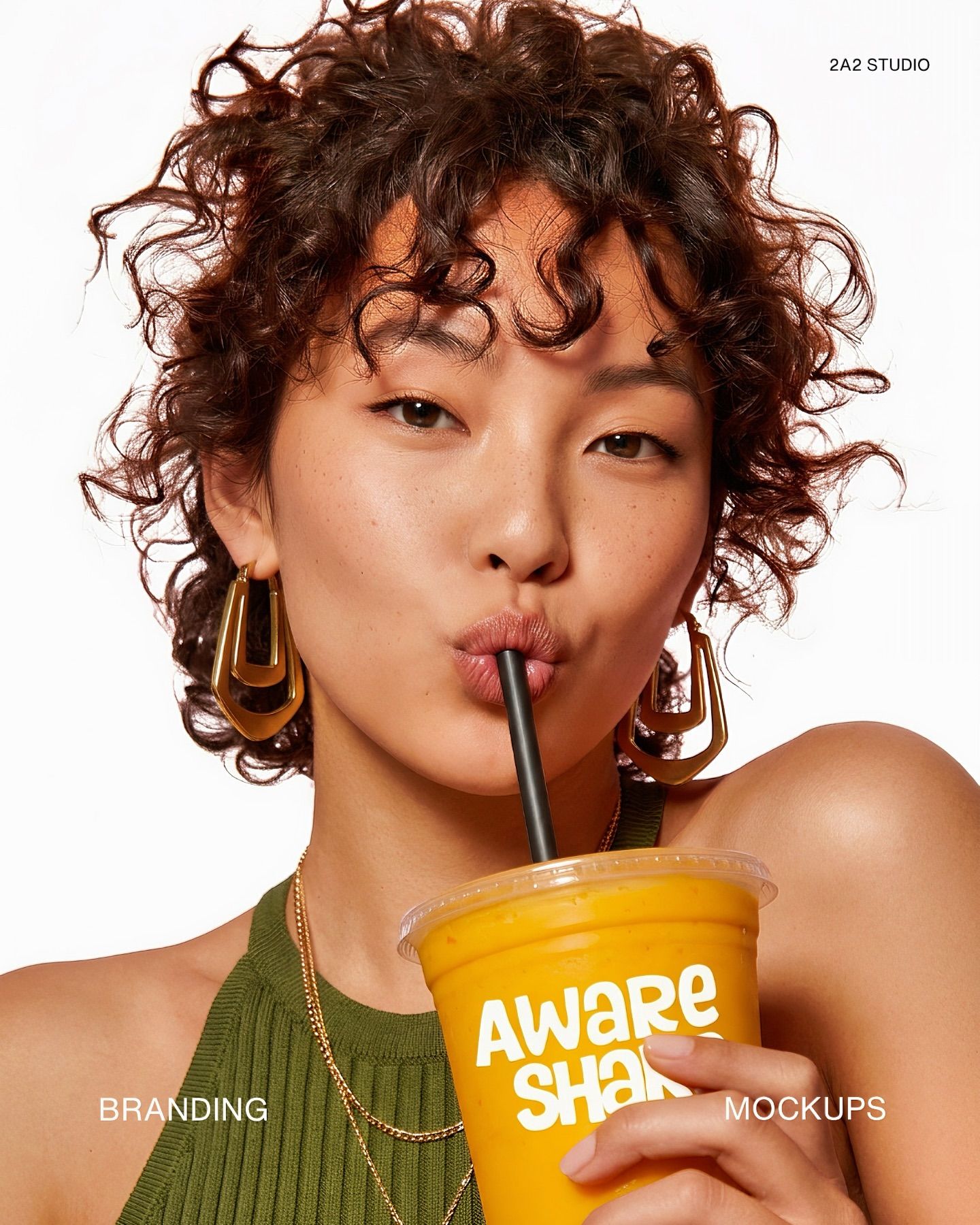 Modelo sosteniendo Aware Shake — campaña producida por 2A2 Studio